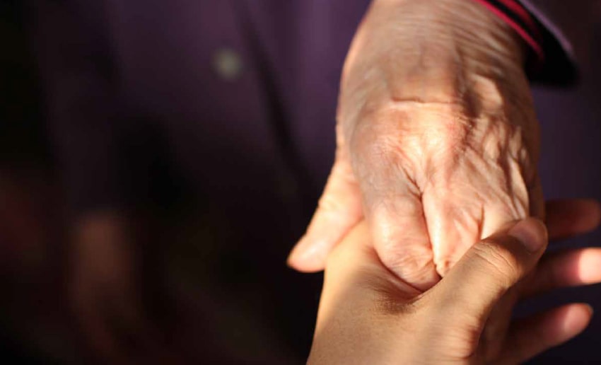 Video preview image showing two people holding hands